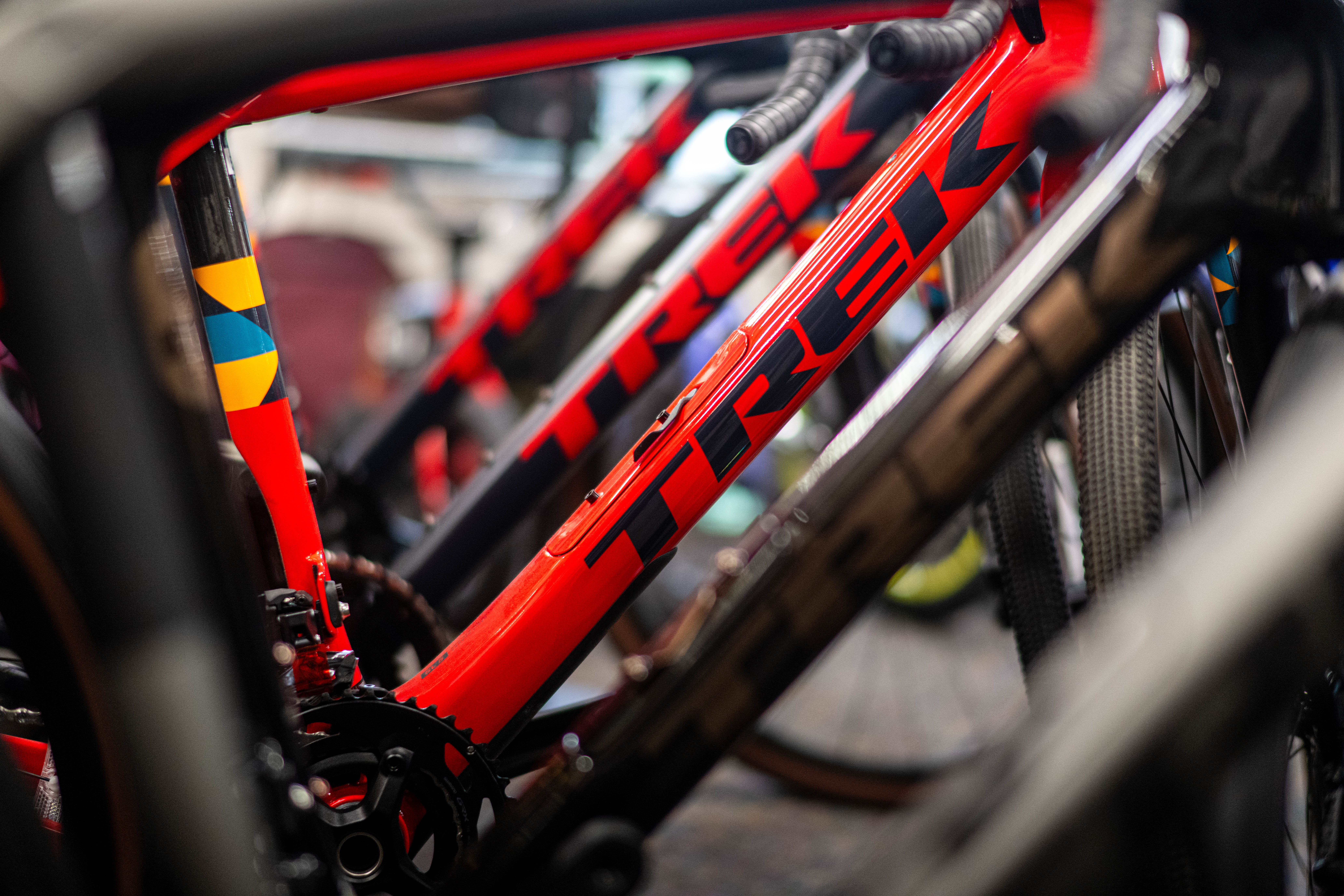 keene bike and ski shop Close-up of a row of red Trek bicycles lined up side by side, with the focus on the frame and branding.